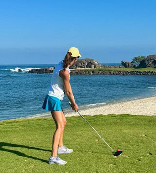 Megan golfing